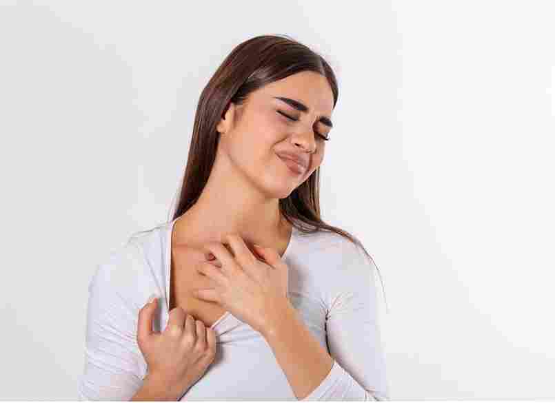 young woman scratching her neck due itching gray background female has itching neck concept allergy symptoms healthcare 11zon