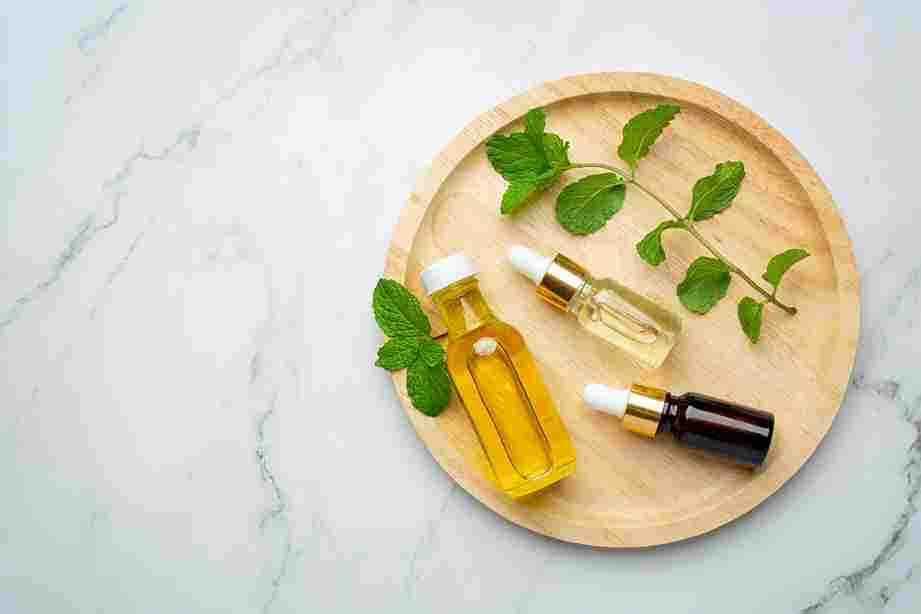 essential oil peppermint bottle with fresh green peppermint 11zon